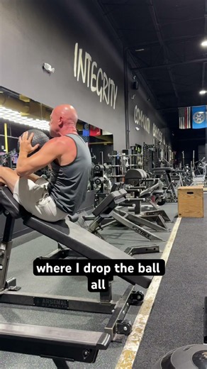 Decline sit up with weighted ball demo. Work the core and sculpt those abs in this exercise. #fit