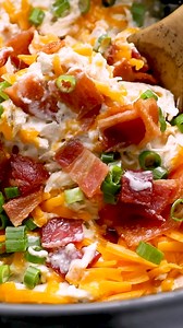This slow cooker Crack Chicken is a rich, creamy dish made with shredded chicken, cream cheese, ranch seasoning, bacon, and cheddar. It's a crowd-pleasing comfort food that's easy to make in a slow cooker or Instant Pot. | The Best Keto and Low Carb Recipes
