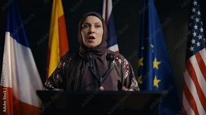 Arab female emotionally speaking about women rights at international conference