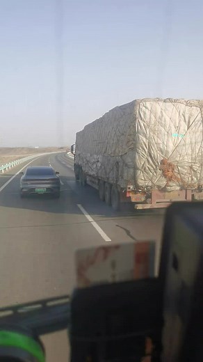 Driving Perspective Inside a Vehicle Following a Truck