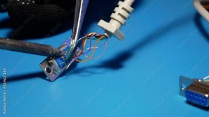 Engineer working soldering wire to COM-port, repair man working process.