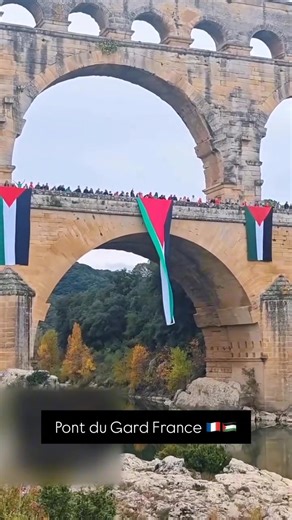 📍Pont du Gard France The Palestinian flag rises proudly above one of the world’s oldest bridges, a timeless landmark of history and heritage. | VPalestine