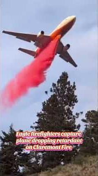 Water tanker drops retardant on Claremont Fire