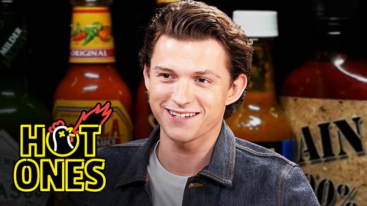 Tom Holland began his career at 12 years old in the West End production of Billy Elliot, and now he’s one of Hollywood’s biggest box office draws, from award-winning performances in The Impossible, to the Marvel Cinematic Universe. On the topic of the latter, his latest is sure to be one of the year’s biggest films of the year—Spiderman: No Way Home, which is set to release in theaters on December 17th. But how is he with spicy food? Find out as Holland takes on the wings of death and discusses 