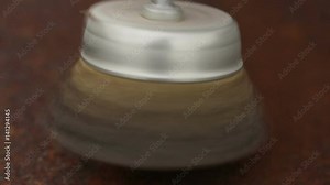 Cleaning a rusty metal sheet with a metal brush