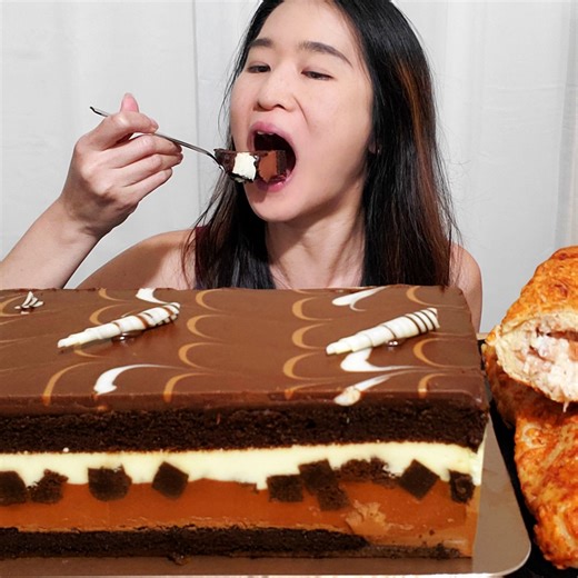 10K views · 233 reactions | Have you tried Costco's Chocolate Mousse Tuxedo Cake? #mukbang #asmr #cake #chocolate | Peggie Neo | Facebook