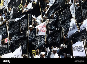 Indonesian Muslims carrying Tawheed flags and other attributes staged rallies in Jakarta, October 26, 2018. The demonstration was carried out following a viral video shows of burning flag bearing Tawheed (Laa Ilaha Illallah, There is no God but Allah, which is the core of Islamic teachings), in Garut, West Java. (Photo by Aditya Irawan/NurPhoto Stock Photo - Alamy