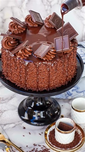 The Best Dark Chocolate Cake Recipe Ingredients For the Chocolate Cake: 1 cup buttermilk 1 cup cooking oil (canola oil recommended) 4 large eggs, at room temperature 1 cup white granulated sugar 2 teaspoons vanilla extract 1 tablespoon instant coffee 2 tablespoons hot water 1 cup dark chocolate chips (or chopped baker’s chocolate) 1 ¾ cups all-purpose flour ¾ cup dark cocoa powder 2 teaspoons baking soda 2 teaspoons baking powder ½ teaspoon salt For the Chocolate Ganache: 1 cup dark chocolate ch