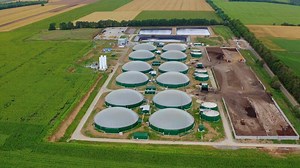 Agricultural biogas plant. Aerial view of green biogas plant storage tanks