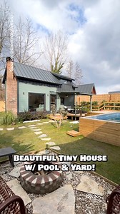 What do you think of this beautiful tiny house with a pool? Would you stay at this tiny home Airbnb for a weekend? Inside, this tiny house features an open living space with a couch & fireplace, a small kitchenette with the basics, a dining table for 2, a bathroom with a tile shower, a small wardrobe, & a lofted bedroom that you can stand in! My favorite part is definitely the outdoor living setup with the covered porch, a pool, & a firepit area to wind down! #tinyhouse #tinyhome #airbnb #hometo