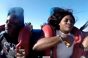 Woman loses wig on slingshot ride