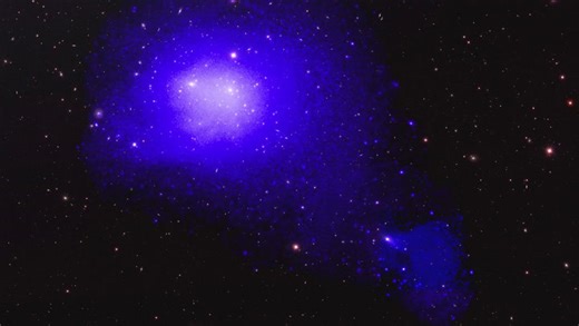 Galaxy cluster leaving trail of hot gas in its wake after eating its neighbor