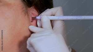 Preparation for an ear piercing in a studio - close up view