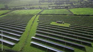 Kingsbridge, South Devon, England: DRONE VIEWS: The drone reverses away from a solar panel farm field for generating electricity. Kingsbridge is a market town and tourist hub in the South Hams area.