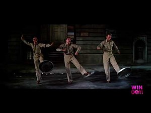 Gene Kelly, Michael Kidd & Dan Dailey dance their famous trash can lid routine.