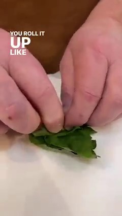 To chiffonade basil (or other herbs) use this simple trick! More tips and tricks: https://cooks.io/3ZLqLKz | Cook's Illustrated