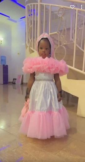 Young Girl in Pink Princess Costume Enjoys Indoor Play