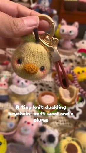 A tiny knit duckling keychain—soft wool and a plump, round form echo the whimsy of Japanese amigurumi craft traditions. #TinyKnitDuckling #AmigurumiKeychain #CozyCrafts #WhimsicalTextiles #fairytalecraft