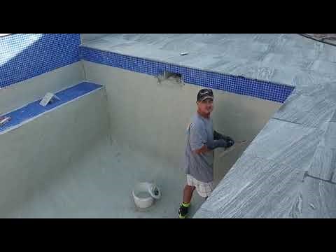 Applying pebblecrete to a pool in Tweed Heads - Bali Pools your Tweed Heads pool builder