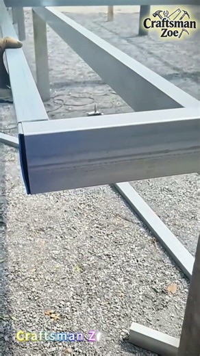 Workers embed hot-dip galvanized square tubes into another square tube
