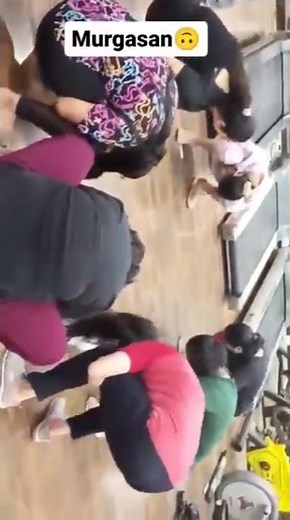 Group of girls murga punishment in circle