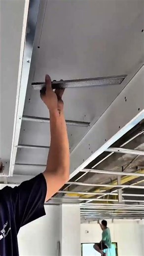 Cutting metal studs and installing gypsum ceiling frames using shears and a drill