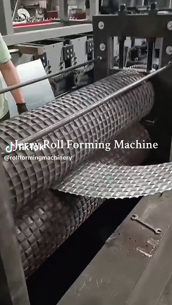 Sheet metal plate embossing roll forming machine