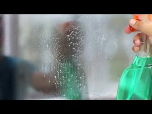 Cleaner Spraying And Wiping Window Stock Video