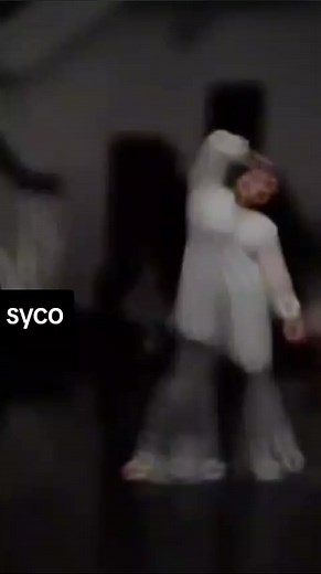 Elegant Dance Performance in a Reflective Studio