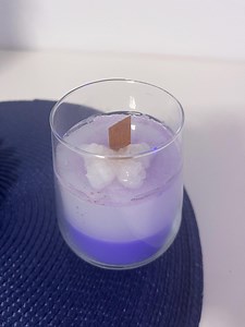 Candle in a glass with a butterfly