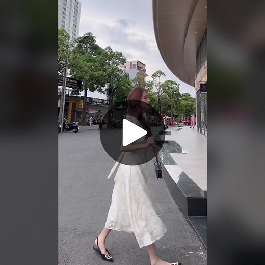 Stylish Urban Walk in a Chic White Dress