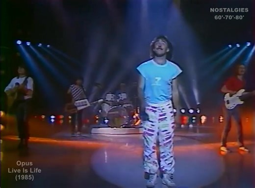 80's... "Live Is Life" : chanson qui reflétait le profond attachement du groupe Opus à la scène... Elle avait été créée lors d'un concert à Oberwart, en Autriche. Le groupe Opus y fêtait ses onze ans d'existence. En France, le titre se hissa à la première place du Top 50. #Opus | Daniel Bourlard