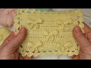 Copertina all'uncinetto con dei fiocchetti - il punto con lo schema anche a due colori. Tutorial.