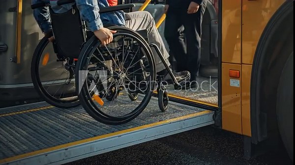Wheelchair User Boarding Public Bus via Accessible Ramp, Highlighting Inclusive Urban Transportation