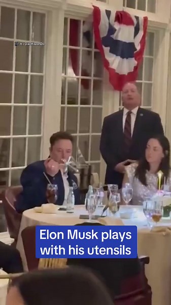 Elon Musk plays with cutlery in official dinner