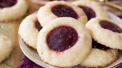 30K views · 106 reactions | These classic thumbprint cookies are made with a simple sugar cookie dough, rolled in sparkling sugar, and then indented and filled with your choice of jam! These are an all-time favorite cookie recipe, and the filling options are absolutely endless! RECIPE: https://sugarspunrun.com/thumbprint-cookies/ | Sugar Spun Run | Facebook