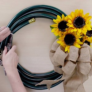 41K views · 98 reactions | Welcome MAY with a new Garden Hose Wreath! Watch how Meg crafts this wreath from dollar store finds in under 5 minutes... | DIY Projects | Facebook
