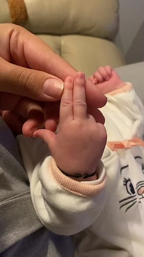 Precious Bond: Baby's Hand Held by Adult