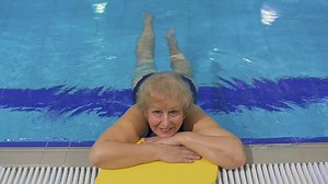 Elderly Woman Enjoys Swimming In Pool Stock Footage SBV-320545064 - Storyblocks