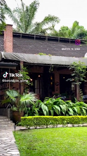 Exploring a Tranquil Garden Surrounding a Brick House