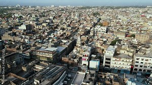 Aerial Flyover Shot of Old Abandoned Hindu Temple in Dense Rawalpindi City. This temple is currently inside a house near famous Imam Bargah of Rawalpindi. Aerial cityscape of Rawalpindi