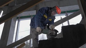 Repair and construction work. Clip. A young team working with cement and material to promote construction.