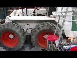 Bobcat 642B - Raising cab with loader arms. - zeketheantiquefreak