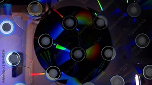 Compact disks shimmer all the colors of the rainbow when you direct a beam of light. Closeup