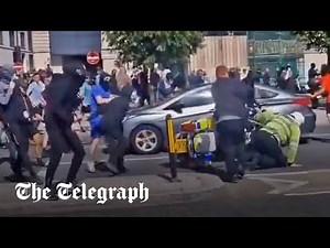 Liverpool clashes: Police officer pushed off motorbike and attacked by far-Right rioters
