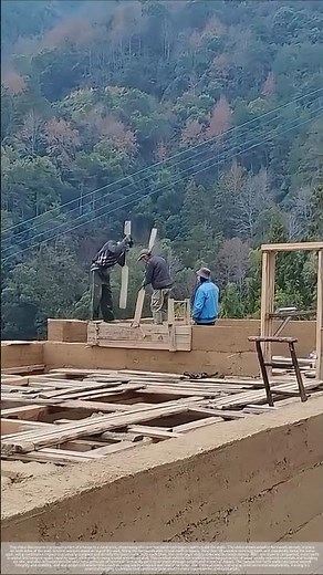 An authentic construction site of a traditional rammed earth wall.