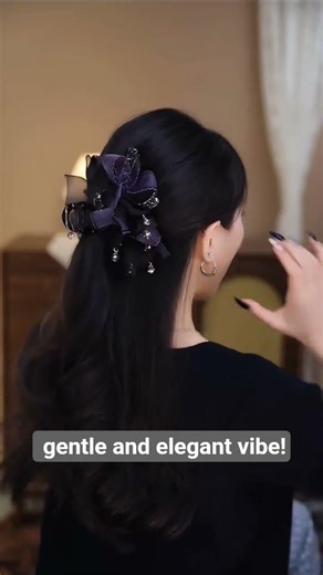 A simple yet sophisticated half-up hairstyle using a claw clip—fail-proof for beginners,