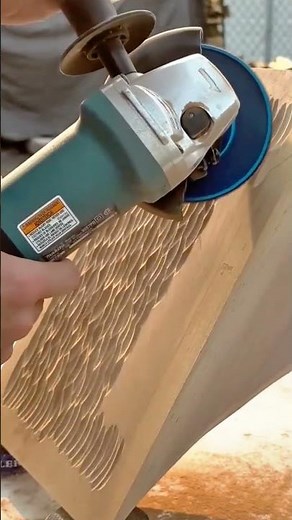 Using an angle grinder to carve intricate textured patterns into wood furniture