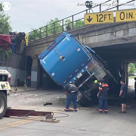 WATCH the moment a garbage truck hits the bottom of a bridge in Kansas City, Missouri, on Thursday (5/19). The police said there were no injuries. | CBS Newspath