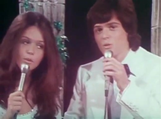 I'm Leaving It (All) Up To You is a classic ballad, but its major success came through cover versions. The most prominent 1970s version is the romantic Pop/Bubblegum Pop rendition by the famous American brother-and-sister duo, Donny and Marie Osmond. The song was originally written and recorded by Don and Dewey in 1957 and later became a US #1 hit in 1963 by Dale & Grace. Donny and Marie revitalized the tune in 1974, turning it into a major crossover hit and cementing their status as a leading P